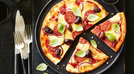 Olive, pepperoni and basil pizza